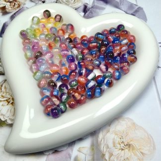 12mm dual-color fine glitter UV photochromic resin round beads, dreamy candy-core loose beads. Color shifts under UV/sunlight and fades back indoors. Smooth beads perfect for DIY bracelets, necklaces and handmade jewelry.